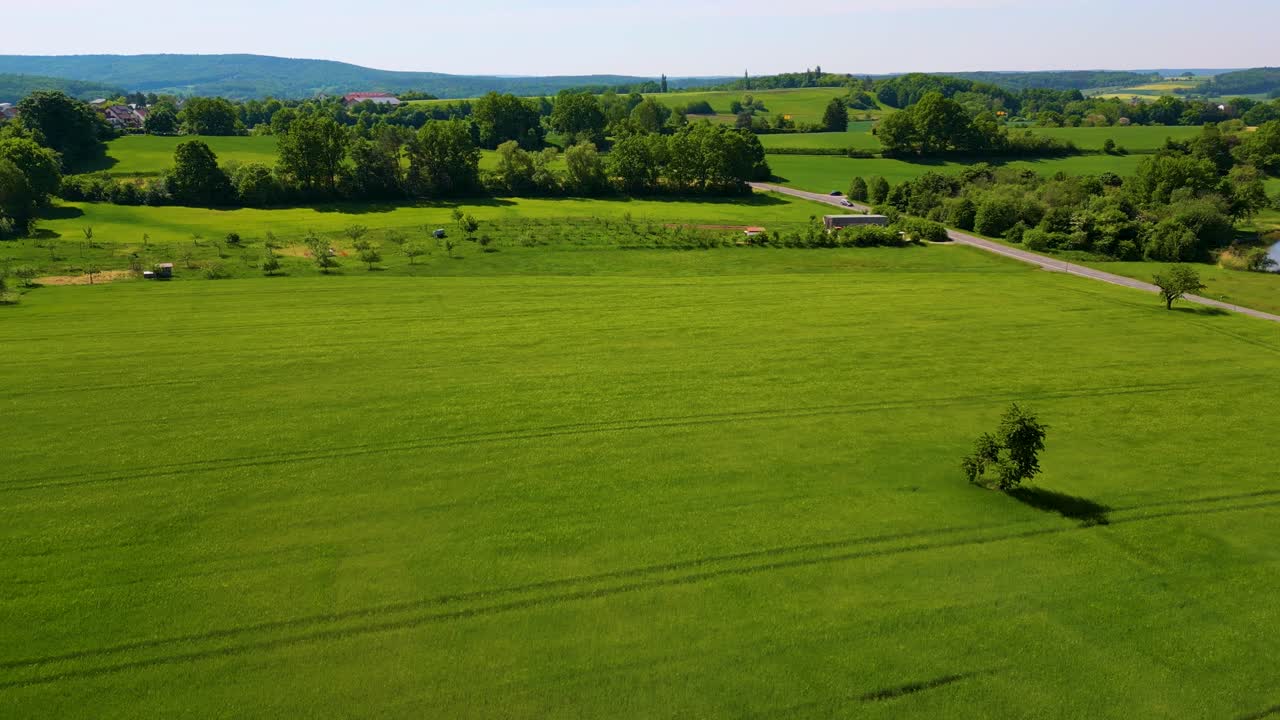 4K Aerial Drone Video of the Village and Farmland Below the Historic Bamberg Castle on the edge of Bamberg, Germany on a Beautiful Spring Day