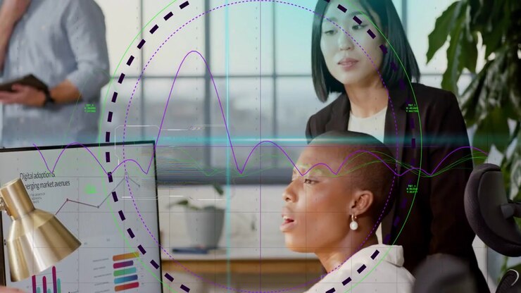 Seated woman and standing peer leaning, animated HUD sweeping, highlighting bars for business goals
