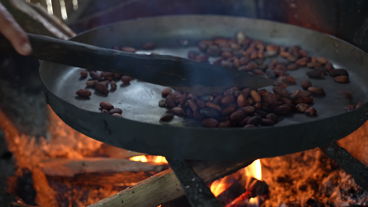 A pan on the stove containing chocolate berries