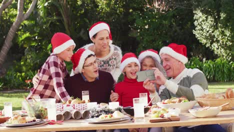 Happy-caucasian-family-having-christmas-dinner-in-garden