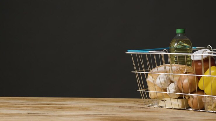 Studio Shot Of Basic Food Items In Supermarket Wire Shopping Basket 11