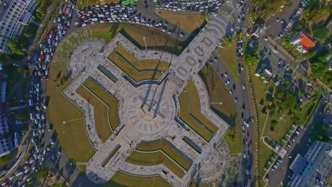 Crazy-and-acrobatic-drone-flying-over-plaza-de-la-Bandera-or-Flag-square-in-Santo-Domingo