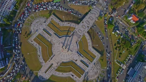crazy and acrobatic drone flying over plaza de la bandera or flag square in santo domingo