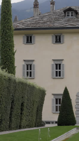historic european villa with manicured gardens and stone roof