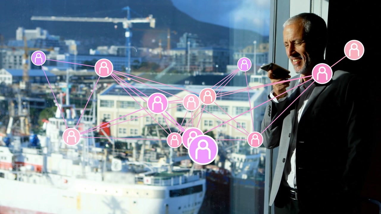 Businessman raising smartphone and speaking beside window, animating AR node network analyzing data