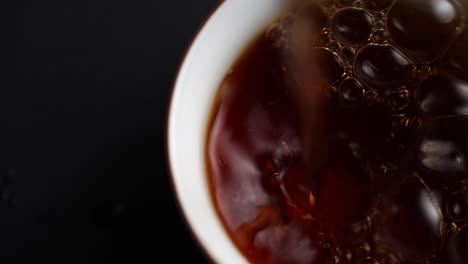 close-up of tea in a white cup