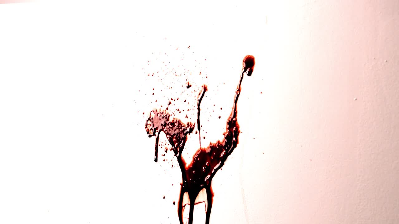 Thick Dark Red Fake Blood Splattered Against White Wall. Shiny Thick Liquid Spatter Dripping. Realistic Slime Texture for Horror. Violent Crime Scene Halloween Spooky Background