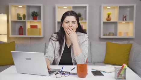home office worker woman looking at camera confused.