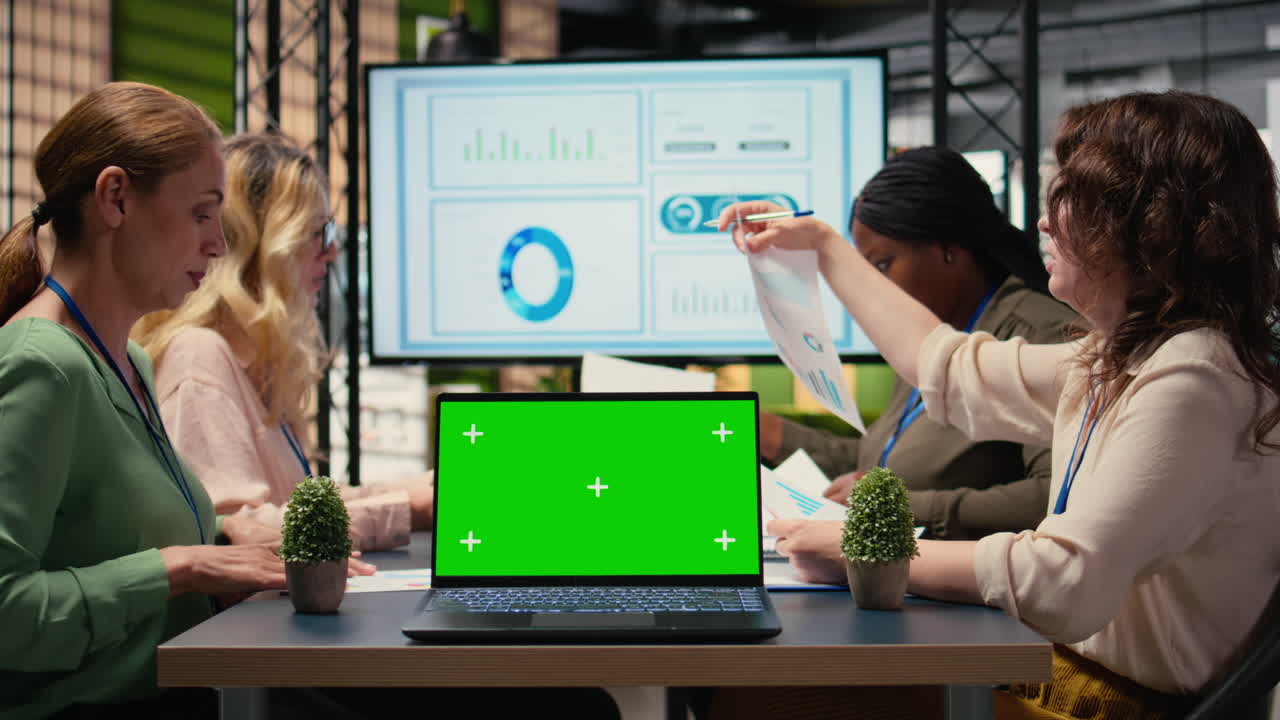 Businesswomen using green screen to present business strategy