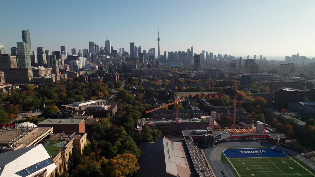 University of Toronto Campus and Queen's Park, 4K aerial shot with city skyline in background