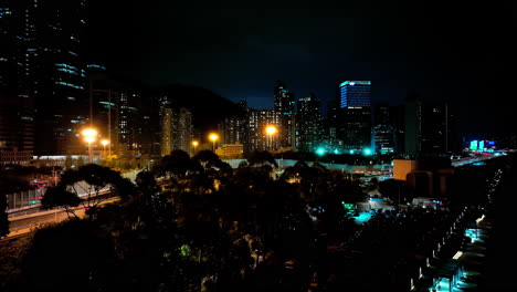 a night view of a city with tall buildings