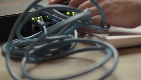 network engineer working on ethernet cable switch