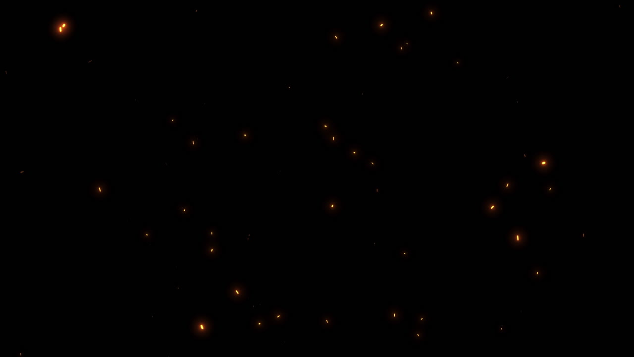 Cámara lenta: Brasas incandescentes ascendiendo sobre fondo negro