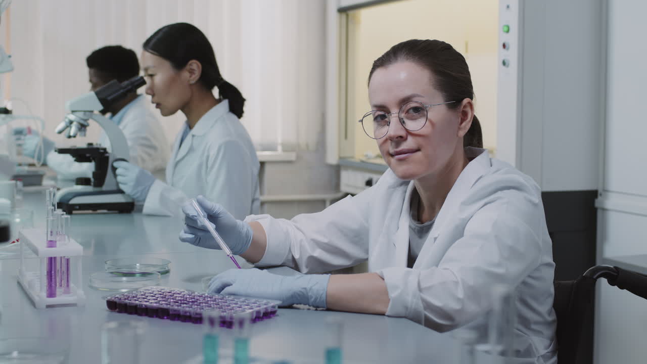 Disabled Female Scientist Working and Posing in Lab