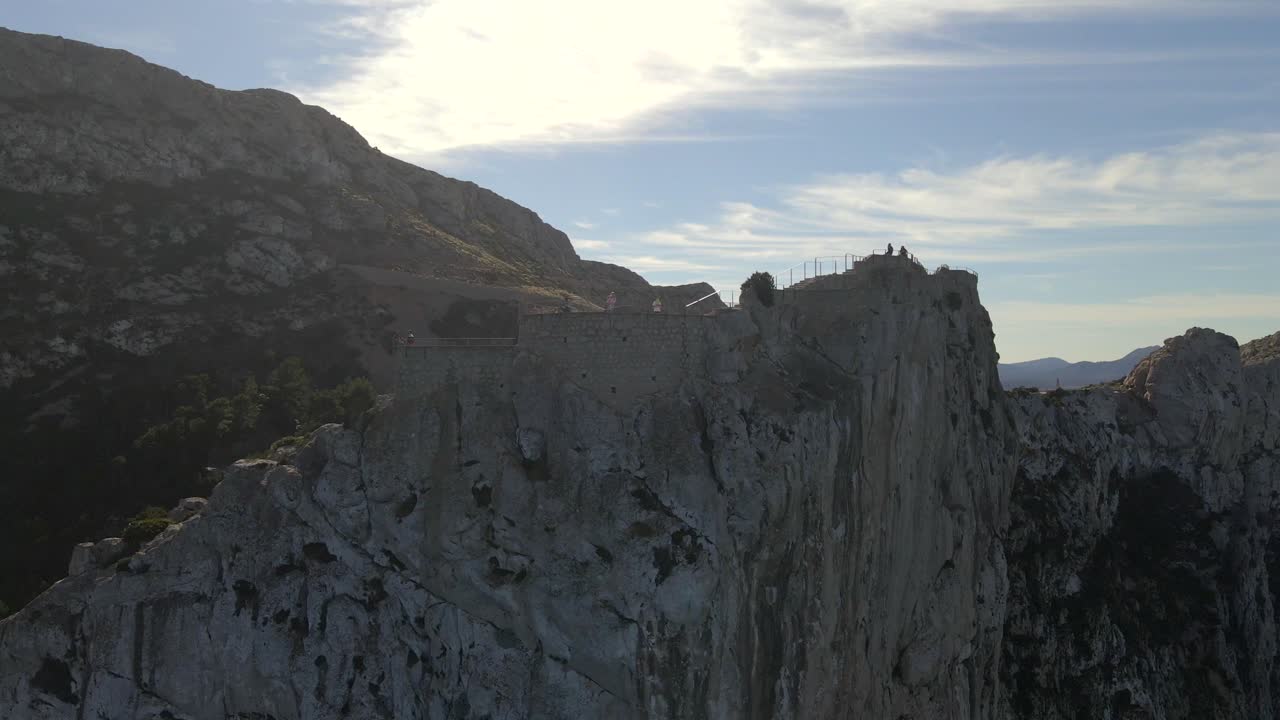 Discover breathtaking landscapes from the viewpoint at Mirador es Colomer, showcasing Pollensa and the majestic Tramuntana mountains at sunset. Nature's beauty unfolds in every direction.
