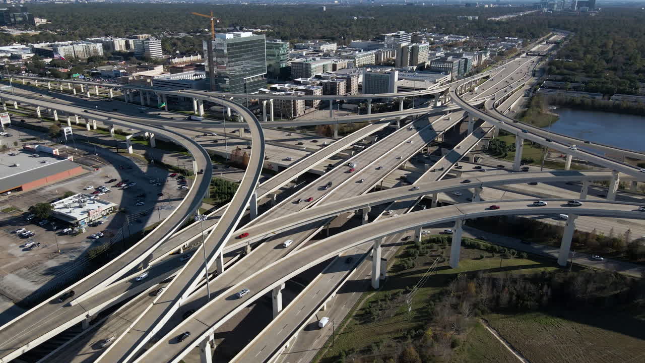 Aerial view Interstate I-10 freeway and Bellway 8 Houston Texas. Establishing shoot of the intersection at I-10 west and Sam Houston Tollway. Drone shot of the highway junction I 10 and Bellway 8