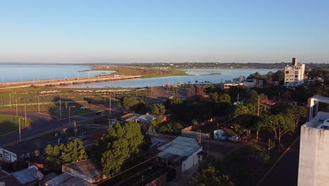 Aerial-drone-view-of-rivers,-bridges,-and-parks-from-the-city-of-Posadas,-Misiones,-Argentina