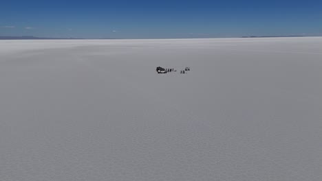 people and cars on salar de uyuni bolivia south america desert salt flats landscapes aerial drone view mountains