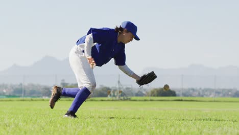 caucasian female baseball player, fielder catching and dropping ball on baseball field