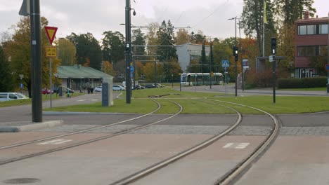 Electric-commuter-train-on-tracks-in-suburban-Helsinki-green-space