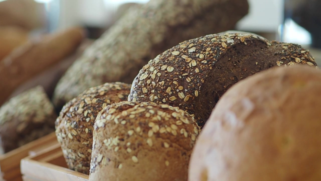 Assortment of Fresh Artisan Seeded Bread and Rolls