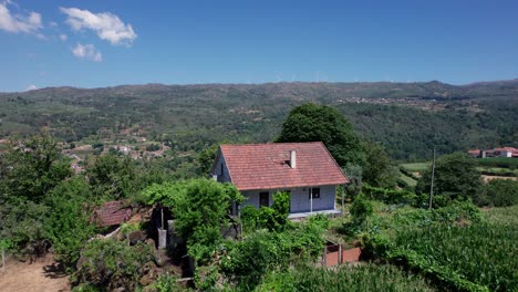 solitary cottage overlooking rural countryside valley in portugal