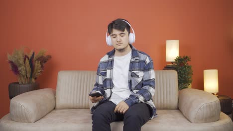 happy man listening to music with headphones.