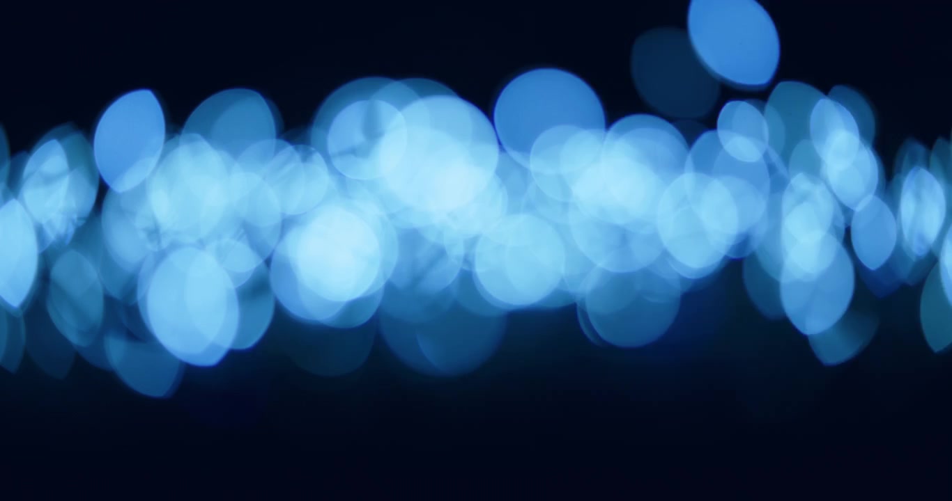Abstract blue colored bokeh background.