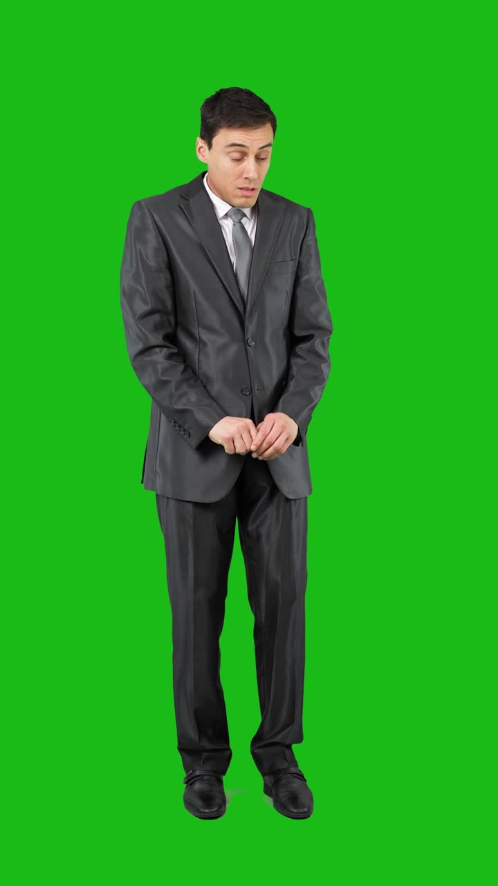Businessman in Suit Demonstrating Various Moods and Actions on Green Screen