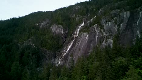 Aerial-view-of-Shannon-Falls-and-rock-slab-with-forest,-Squamish,-BC,-Canada
