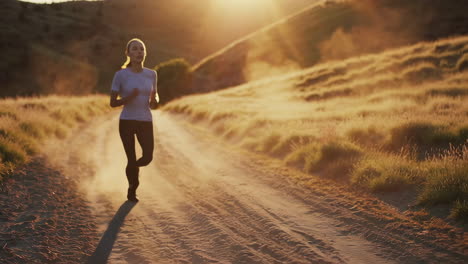 woman trail running at sunset