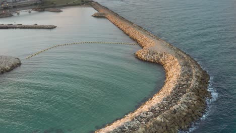 aerial view of a harbor breakwater