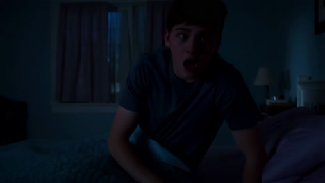 Young Man Wakes Up Startled in Bed at Night