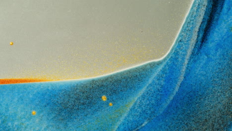 abstract fluid art with gold glitter