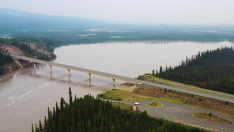 Aerial-view-of-Tanana-River-and-bridge-over-Tanana-river-in-Alaska-Range---The-landscape-around-Alaska-Highway,-Alaska,-USA