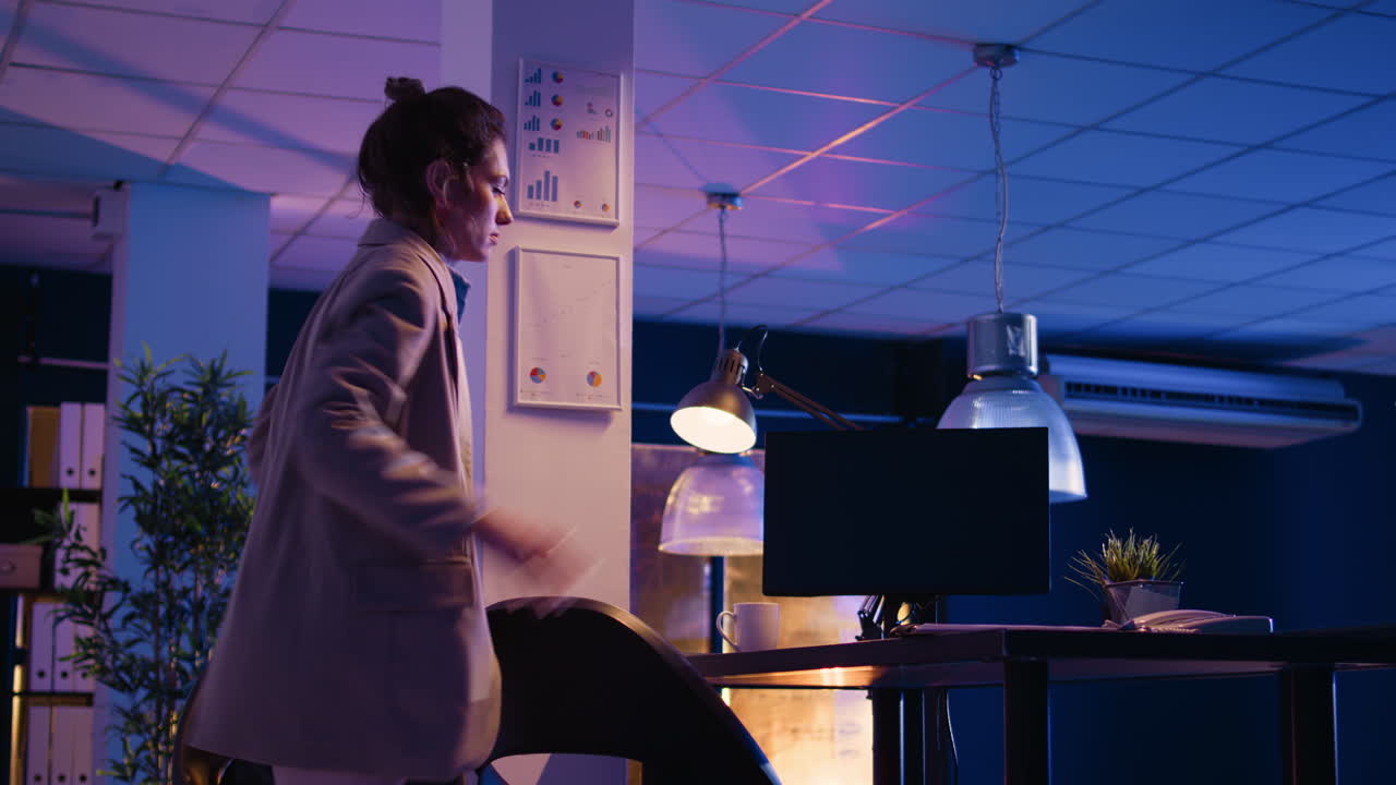 Businesswoman working late at night in the office