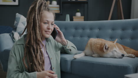 woman talking on phone with dog