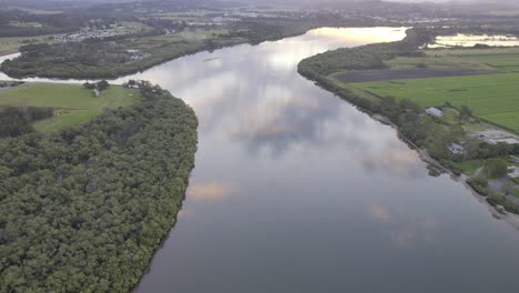 maroochy river with sky reflection in sunshine coast region, queensland, australia - aerial shot