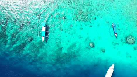 A-Stunning-Scenery-Of-Tourist-Boats-Floating-By-The-Sea---Aerial-Shot