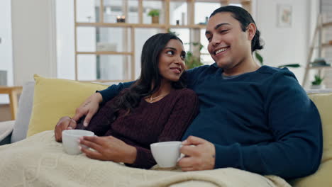 Laugh,-coffee-and-couple-watching-tv