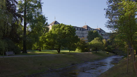 stunning vista of brenners park-hotel and spa from afar in baden-baden, germany - wide shot