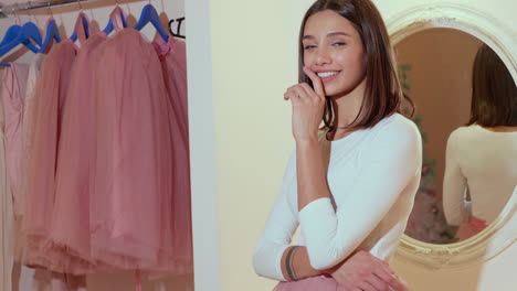 woman trying on pink tulle skirt