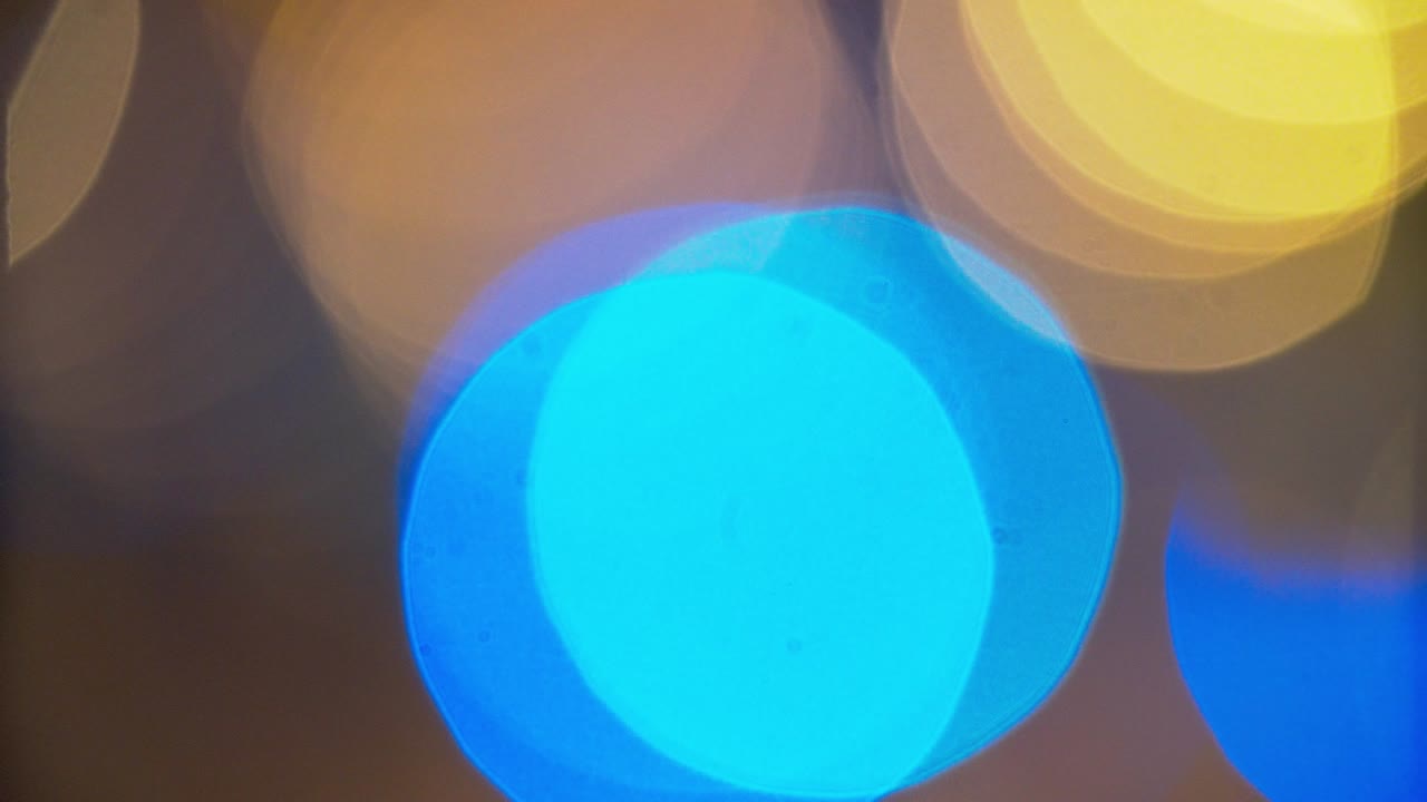 Defocused Glowing Colorful Lights Background