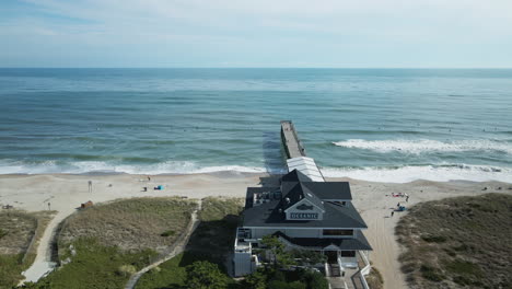 Aerial-orbiting-past-Jonnie-Mercer-Pier-Wrightville-beach-north-Carolina