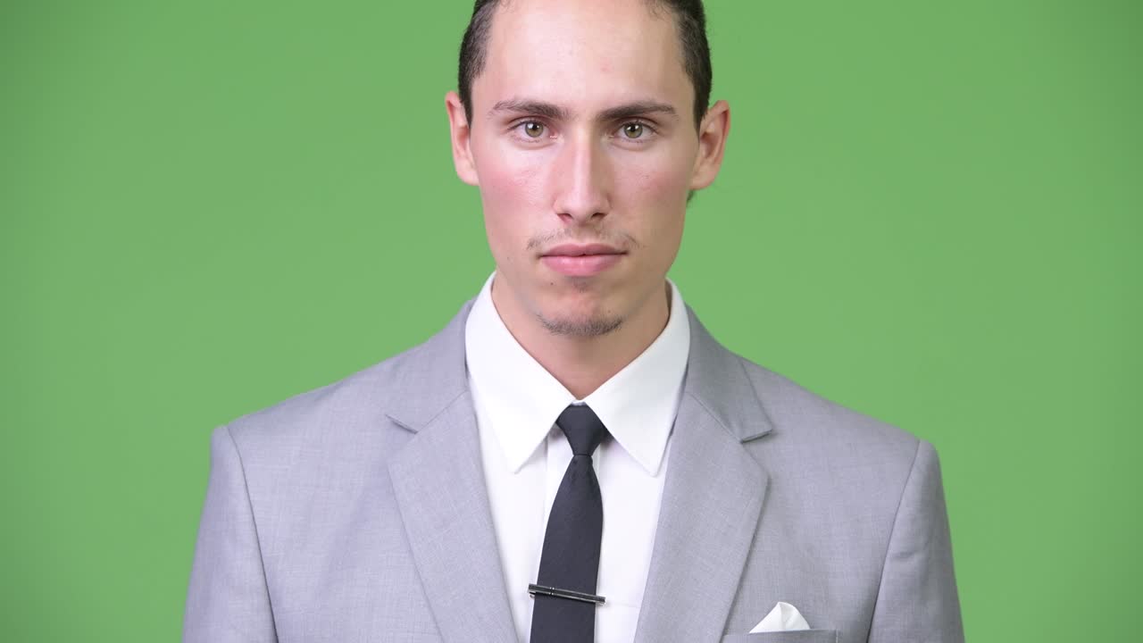 Young handsome businessman smiling