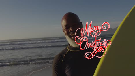 Animación-De-Texto-De-Feliz-Navidad-Sobre-Un-Hombre-Afroamericano-Mayor-En-La-Playa