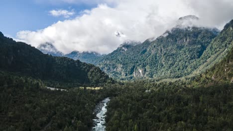 Aerial-hyperlapse-dolly-out-of-the-foggy-mountains-in-Hornopiren-National-Park,-Hualaihue,-Chile