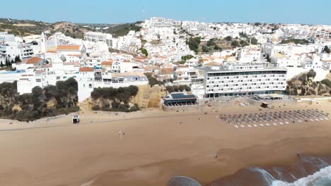 Panoramic-of-Albufeira-mediterranean-shoreline-in-Algarve,-Portugal---Pan-Aerial-shot