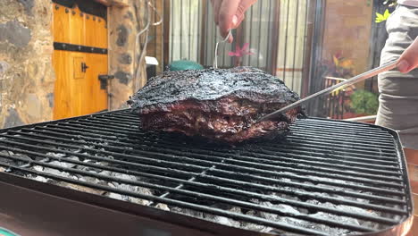 slow motion scene of juicy cut of argentinian meat on the grill