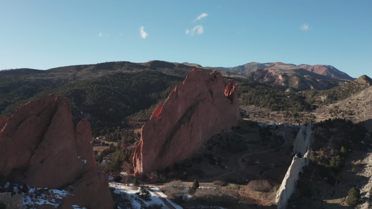 Aerial parallax around red rock formations in Garden of the Gods, Colorado.